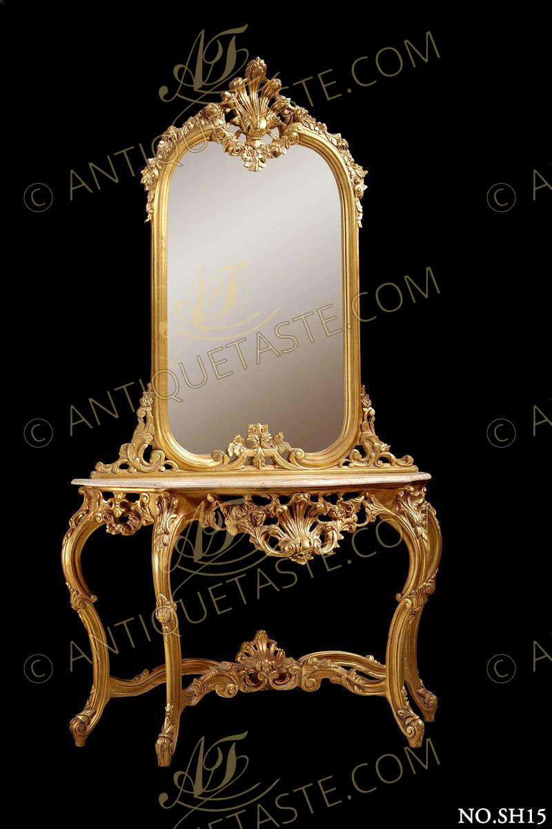 A captivating Louis XV period carved and gilt wood Rococo style grand console with mirror, The impressive hand carved piece is gilded with 18. carat French gold foils. The serpentine shape elegant scalloped and pierced frieze and sides have an enchanting central reserve decorated with blossoming acanthus sprays branching from the central seashell, and topped with serpentine shape white marble.The c-scrolled foliate carved cabriole turning legs are joined by an scrolled “X” stretcher centered by a seashell amidst berried foliate. The mirror base has an elaborately carved floral rococo scroll and surmounted by a blossoming garland surmounted by a central urn issuing a large beautiful scallop acanthus flanked by a blossoming swaged garland extended to a portion of the sides